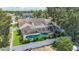 An aerial view showcases the screened-in pool and landscaped yard, enhancing the appeal of the home at 11216 Longbrooke Dr, Riverview, FL 33579