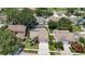 Aerial view of a private residence with a screened-in pool, surrounded by lush greenery at 11216 Longbrooke Dr, Riverview, FL 33579
