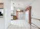 Dining area featuring white tile flooring, windows with decor, and a pendant light at 11216 Longbrooke Dr, Riverview, FL 33579