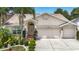 Charming single-story home featuring a well-manicured lawn and attached three car garage at 11216 Longbrooke Dr, Riverview, FL 33579