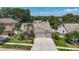 Charming single-story home with a well-manicured lawn, mature trees, and a two-car garage at 11216 Longbrooke Dr, Riverview, FL 33579