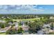 Aerial view of a golf course and pond surrounded by homes and mature trees at 11216 Longbrooke Dr, Riverview, FL 33579