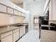 Efficient kitchen layout with granite countertops, white cabinets, and modern appliances at 11216 Longbrooke Dr, Riverview, FL 33579
