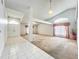Expansive living area featuring tiled entry and carpeted flooring at 11216 Longbrooke Dr, Riverview, FL 33579
