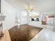 Spacious living room featuring wood and tile flooring, open layout, and natural light at 11216 Longbrooke Dr, Riverview, FL 33579
