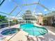 Enjoy the screened-in pool and spa with surrounding deck, creating a perfect outdoor entertainment space at 11216 Longbrooke Dr, Riverview, FL 33579