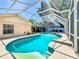 Enjoy the screened-in pool with surrounding deck, perfect for relaxation and outdoor entertainment at 11216 Longbrooke Dr, Riverview, FL 33579