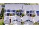 Aerial view of townhomes showing garages and fenced patios at 11531 Shipwatch Dr # 1030, Largo, FL 33774