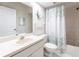 Cozy bathroom with a single sink vanity and shower with shower curtain at 11531 Shipwatch Dr # 1030, Largo, FL 33774
