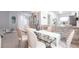Formal dining room features glass table, shell chairs, and granite counters at 11531 Shipwatch Dr # 1030, Largo, FL 33774