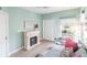Cozy living area with a fireplace, daybed, and lots of natural light at 11531 Shipwatch Dr # 1030, Largo, FL 33774