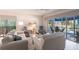 Spacious living room with plenty of natural light and access to the lanai at 11531 Shipwatch Dr # 1030, Largo, FL 33774