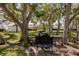 Outdoor grilling area with mature trees offering shade at 11531 Shipwatch Dr # 1030, Largo, FL 33774