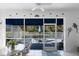 Screened patio features a glass-topped table and view of the pool at 11531 Shipwatch Dr # 1030, Largo, FL 33774