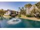 Lakeside view of building and fountains from across the pond at 11531 Shipwatch Dr # 1030, Largo, FL 33774