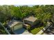 Charming home features a detached garage, private fenced yard, and mature trees, offering a serene living environment at 1155 Withlacoochee St, Safety Harbor, FL 34695
