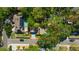 Aerial view of a property highlighted with a red border showing a pool and surrounding greenery at 1155 Withlacoochee St, Safety Harbor, FL 34695