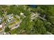 Gorgeous aerial view of residential neighborhood with tree-lined streets and a beautiful lake at 1155 Withlacoochee St, Safety Harbor, FL 34695