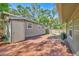 Backyard featuring a brick-paved patio and outdoor lighting for evening enjoyment at 1155 Withlacoochee St, Safety Harbor, FL 34695
