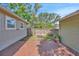 Beautiful backyard featuring brick-paved area and a wooden fence, offering a private outdoor space at 1155 Withlacoochee St, Safety Harbor, FL 34695