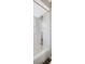 Clean bathroom with tub shower combo and decorative vertical tile at 1155 Withlacoochee St, Safety Harbor, FL 34695