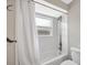 Bright bathroom featuring a shower-tub combination with modern fixtures at 1155 Withlacoochee St, Safety Harbor, FL 34695