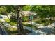Charming single story home with mature trees, lush landscaping, and well-maintained lawn at 1155 Withlacoochee St, Safety Harbor, FL 34695