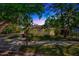 Charming home with a well-manicured lawn and mature trees offering shade and curb appeal at 1155 Withlacoochee St, Safety Harbor, FL 34695