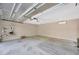 Two car garage with a clean concrete floor, overhead lighting, and ample space for parking and storage at 1155 Withlacoochee St, Safety Harbor, FL 34695