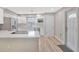 Bright kitchen with stainless appliances, white cabinets, and a breakfast bar at 1155 Withlacoochee St, Safety Harbor, FL 34695