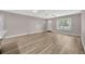 Bright living room has modern flooring, with view of the front door and kitchen at 1155 Withlacoochee St, Safety Harbor, FL 34695