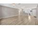 Open living space with modern floors, neutral paint, and multiple ceiling fans at 1155 Withlacoochee St, Safety Harbor, FL 34695
