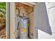 Enclosed outdoor area with a water heater and plumbing fixtures, neatly organized and accessible at 1155 Withlacoochee St, Safety Harbor, FL 34695