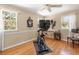 Bedroom with wood floors and three windows providing ample natural light at 1211 S Druid Ln, Tampa, FL 33629