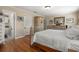 This bedroom boasts hardwood floors, a decorative wardrobe, and a light-filled ambiance at 1211 S Druid Ln, Tampa, FL 33629