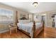 A spacious bedroom offers hardwood floors, natural light, and decorative wood trim on the walls at 1211 S Druid Ln, Tampa, FL 33629