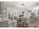 Dining area with counter-height table and chairs leading to the bright kitchen at 1211 S Druid Ln, Tampa, FL 33629