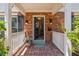 Inviting brick porch with potted plants and a welcoming entrance at 1211 S Druid Ln, Tampa, FL 33629