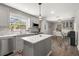 Kitchen features stainless appliances, a center island, and a breakfast nook with seating at 1211 S Druid Ln, Tampa, FL 33629