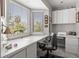 Bright office space with built-in cabinets, desk, and large windows offering great natural light at 1211 S Druid Ln, Tampa, FL 33629