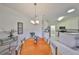 Open concept dining area, showcasing natural light and access to kitchen and living room at 1216 Lyndhurst Greens Dr, Sun City Center, FL 33573