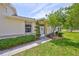 Cozy front entrance with well-maintained landscaping and a welcoming atmosphere at 1216 Lyndhurst Greens Dr, Sun City Center, FL 33573