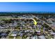 Aerial view shows the property's location, set against a backdrop of a coastal cityscape at 13057 89Th Ave, Seminole, FL 33776