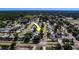 Aerial view pointing to a house in a residential neighborhood near the ocean at 13057 89Th Ave, Seminole, FL 33776