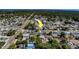 Aerial view of a home in a residential area, highlighted with an arrow at 13057 89Th Ave, Seminole, FL 33776