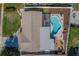 Aerial view of home featuring a private backyard with a lovely in-ground pool and deck at 13057 89Th Ave, Seminole, FL 33776