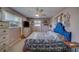 Comfortable bedroom featuring light pink walls, ceiling fan, and natural light from the window at 13057 89Th Ave, Seminole, FL 33776