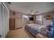 Comfortable bedroom with ceiling fan, closet, and neutral carpet at 13057 89Th Ave, Seminole, FL 33776