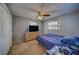 Bedroom featuring a ceiling fan, closet and natural light at 13057 89Th Ave, Seminole, FL 33776