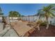 Charming wooden deck with lounge chairs, offering a peaceful outdoor retreat with a well-maintained privacy fence at 13057 89Th Ave, Seminole, FL 33776